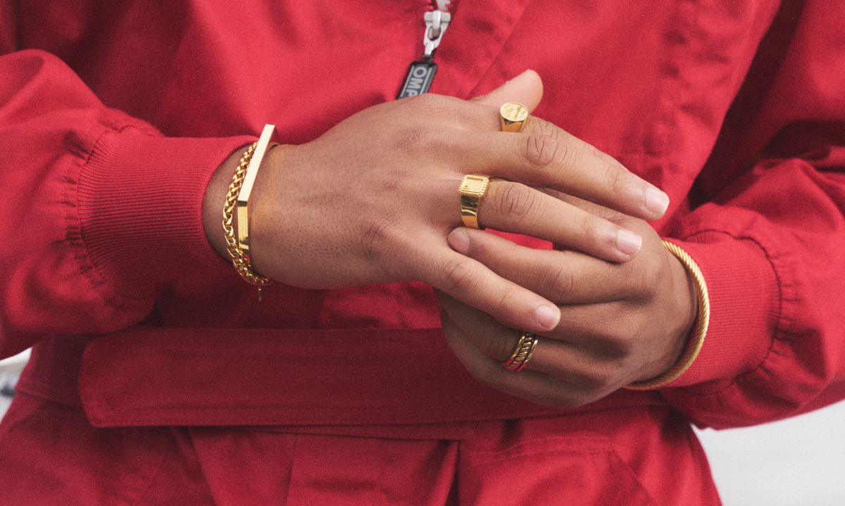 man wearing gold plated jewellery