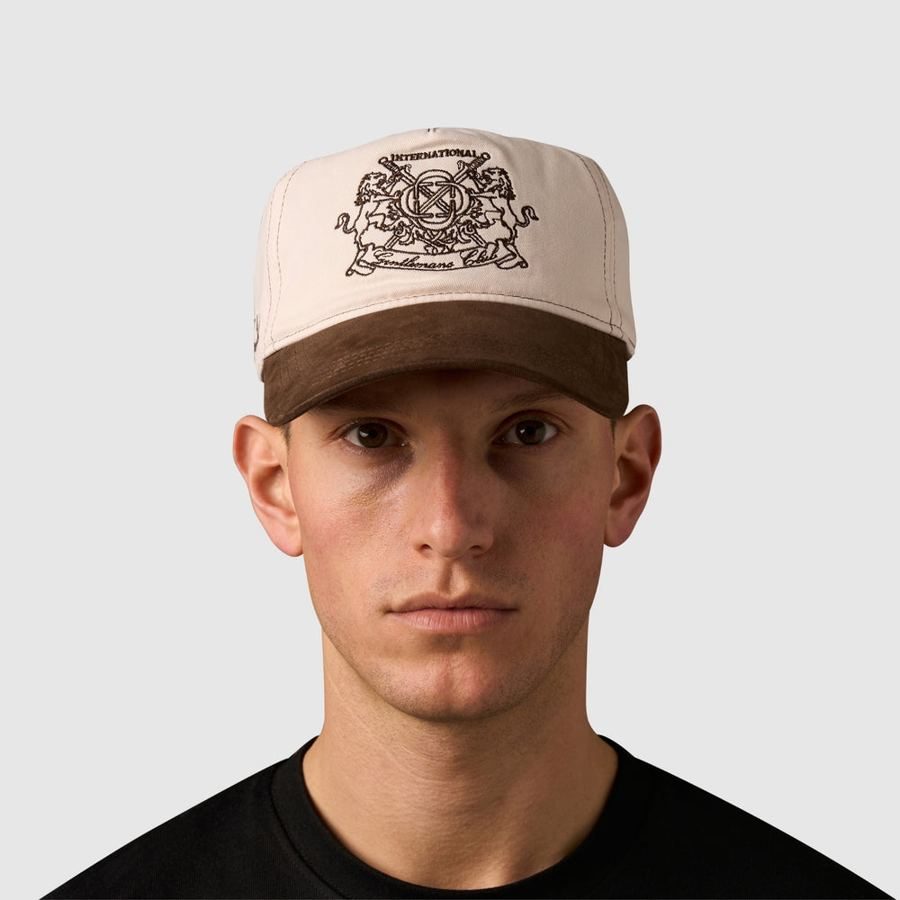 Model wearing the cream and brown Gentlemen's Club Cap